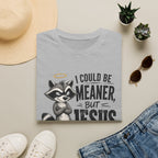 T‑Shirt — "I Could Be Meaner But Jesus Said No" Cute Raccoon Christian Tee
