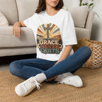 Christian T-Shirt — "Grace Never Quits" Retro Cross Sunrise Tee